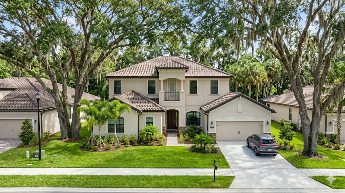 Seamless gutters beneath the mature oaks that define Oviedo's established neighborhoods
